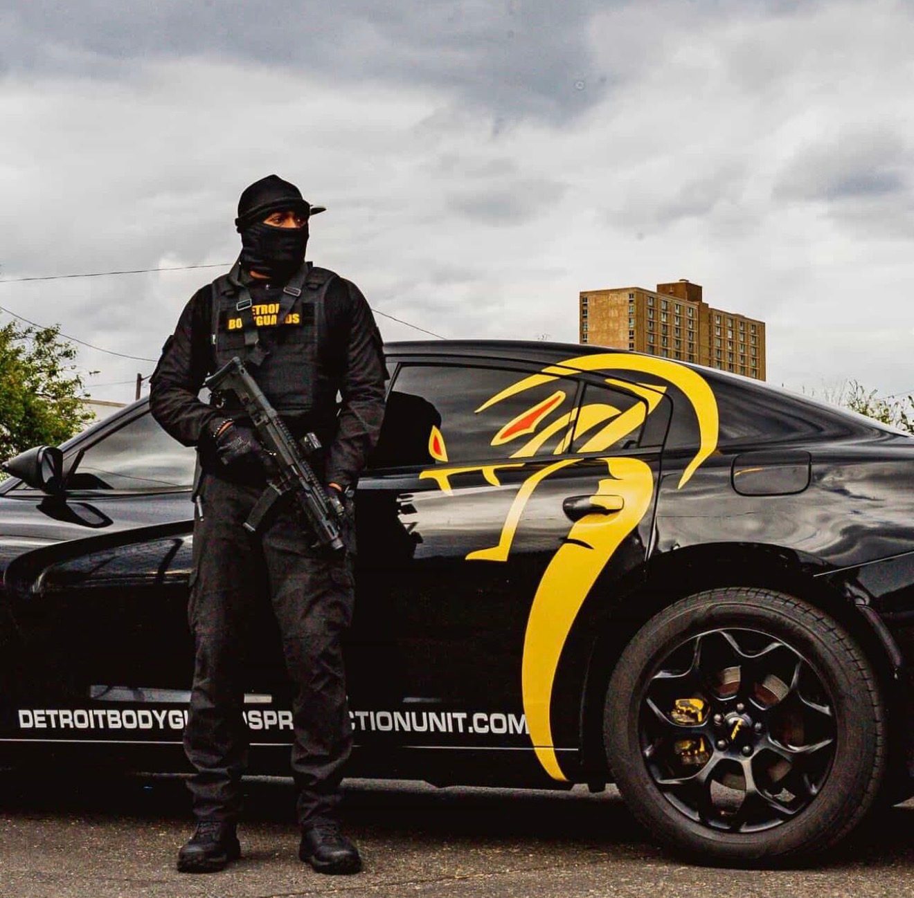 Detroit Body Guards branded patrol vehicle with an armed officer